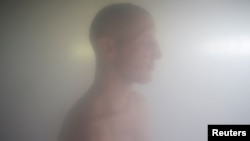 Turkish-German patient Cengiz takes a steam bath two days before his ordination as a Buddhist monk, at Wat Thamkrabok monastery in Saraburi province, Thailand, March 28, 2017.