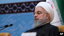 FILE - In this photo released by official website of the office of the Iranian Presidency, President Hassan Rouhani attends an annual Islamic Unity Conference in Tehran, Iran, Nov. 24, 2018. 