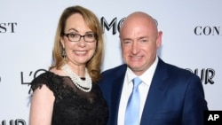 FILE- Politician and gun control advocate Gabrielle Giffords and husband, retired astronaut Mark Kelly, attend the Glamour Women of the Year Awards at Spring Studios in New York., Nov. 12, 2018. 