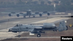 FILE - A U.S. Air Force A-10 Thunderbolt II fighter jet lands at Incirlik airbase in the southern city of Adana, Turkey, Dec. 10, 2015.