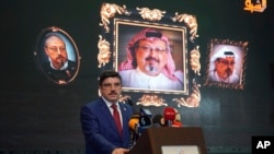Yasin Aktay, an advisor to Turkey's President Recep Tayyip Erdogan, speaks during an event organized to mark the 40th day of the death of Saudi writer Jamal Khashoggi, in Istanbul, late Sunday, Nov. 11, 2018.