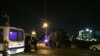 Security officials park near the approach toward the Israeli embassy in Amman, Jordan, on Sunday, July 23, 2017.