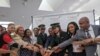 An all-female flight crew from Ethiopian Airlines celebrates at Washington Dulles International Airport after arriving from Addis Ababa, March 8, 2020 (Eden Geremew/VOA)