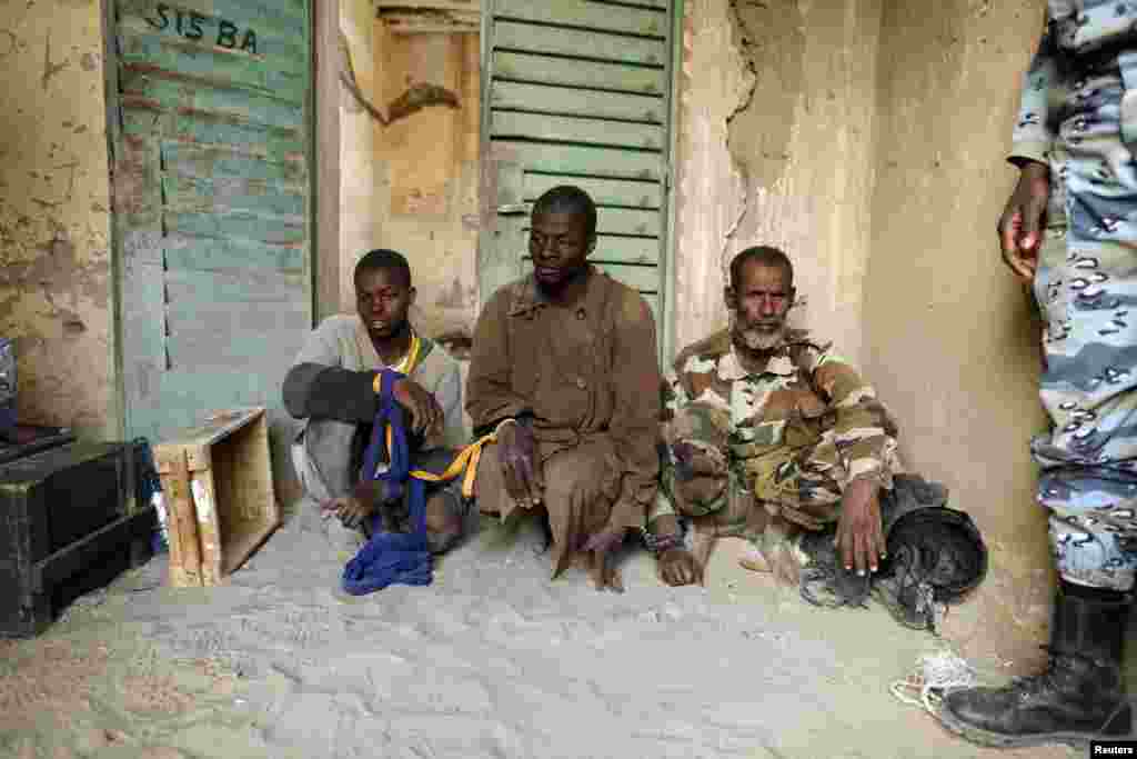 Islamist rebel prisoners guarded by Malian gendarmes are seen at a military camp in the center of Timbuktu February 1, 2013.