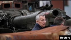 NATO Secretary-General Jens Stoltenberg visits an exhibition displaying destroyed Russian military vehicles, amid Russia's attack on Ukraine, in central Kyiv, Ukraine April 20, 2023.