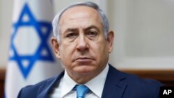 Israeli Prime Minister Benjamin Netanyahu chairs the weekly cabinet meeting at the Prime Minister's office in Jerusalem, Feb. 11, 2018.