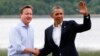 Britain's Prime Minister David Cameron (L) welcomes U.S. President Barack Obama on his arrival to the Lough Erne golf resort where the G8 summit is taking place in Enniskillen, Northern Ireland,l June 17, 2013. 
