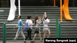 Tourists at a shopping center in Bangkok, Thailand, June 27, 2016. 