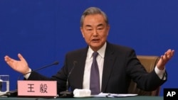 Chinese Foreign Minister Wang Yi speaks during a press conference on the sideline of the National People's Congress in Beijing, March 7, 2025.