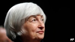 FILE - Federal Reserve Chair Janet Yellen listens to introductions as she is awarded the Paul H. Douglas Award for Ethics in Government, on Capitol Hill in Washington, Nov. 7, 2017.