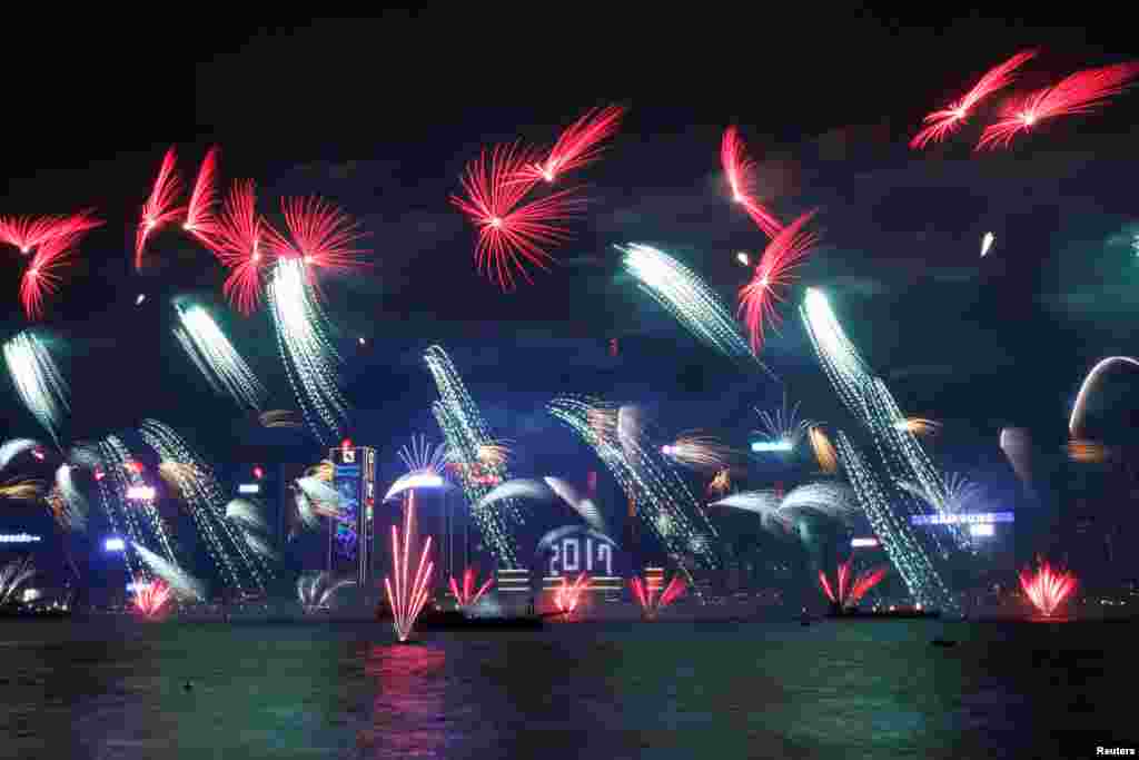 Fireworks explode as "2017" is displayed at the Hong Kong Convention and Exhibition Centre during New Year celebrations, Jan. 1, 2017.