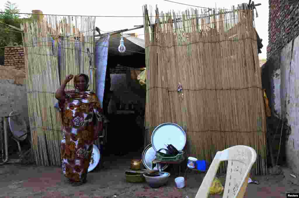 An Eritrean refugee poses for a picture inside her home in Khartoum, Sudan, June 19, 2014.