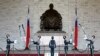FILE - Honour guards perform in front of a statue of late Nationalist Generalissimo Chiang Kai-shek in Taipei, Feb. 7, 2007.