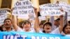 FILE - Vietnamese protesters hold banners reading "Formosa destroys the environment, which is a crime" and "I love the sea, shrimp and fish" during a rally denouncing recent mass fish deaths in Vietnam's central province, in Hanoi, Vietnam, May 1, 2016.