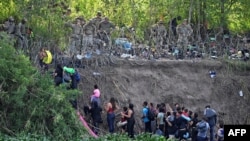 Los migrantes que cruzaron el río Bravo son detenidos por miembros de la Guardia Nacional de EEUU. Matamoros, estado de Tamaulipas, México , el 10 de mayo de 2023.