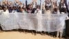 Some Rohingya refugees in Cox's Bazar, Bangladesh, are protesting against the community's repatriation to Myanmar, carrying a festoon on which their demands for repatriation are written. 