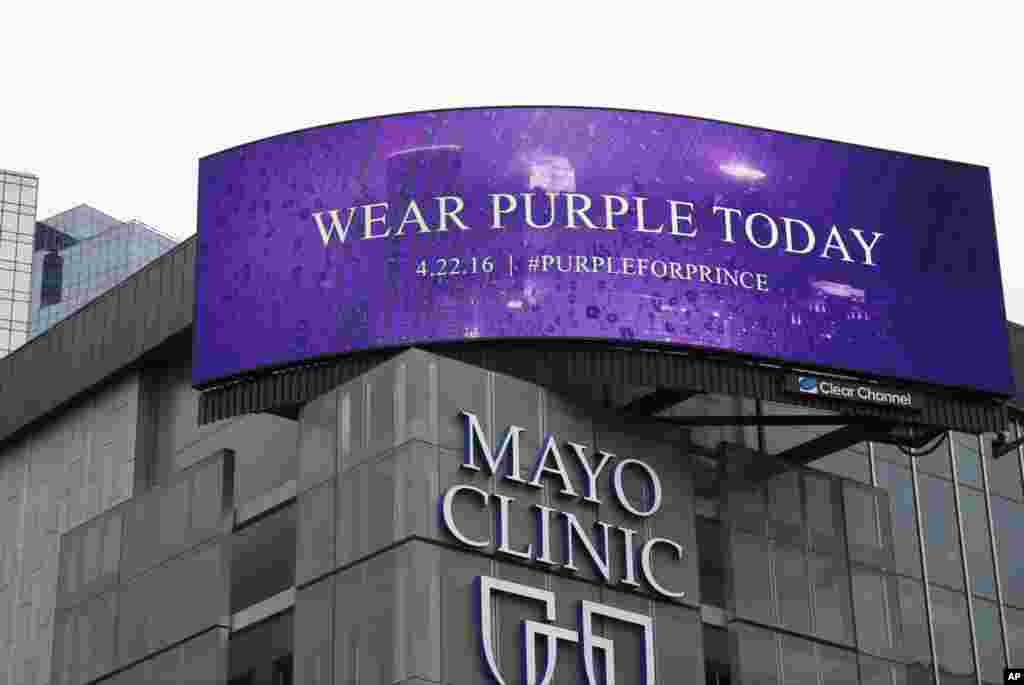 A sign above the Mayor Clinic in Minneapolis, April 22, 2016, asks people to wear purple in memory of the pop super star Prince who died Thursday at the age of 57.