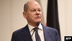 Olaf Scholz (Photo by kola sulaimon / AFP)