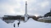 People stand in an area covered with snow in the Finnish capital of Helsinki on Jan. 3, 2024, as a cold snap hit the country. Despite the frigid temperatures across much of Europe, analysts say Europe is less dependent on Russian energy imports this winter.