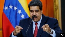 Venezuelan President Nicolas Maduro gives a press conference at Miraflores presidential palace in Caracas, Venezuela, Jan. 25, 2019.