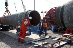 FILE - Workers are seen at the&nbsp;construction site&nbsp;of the Nord&nbsp;Stream&nbsp;2 gas pipeline, near the town of Kingisepp, Leningrad region, Russia, June 5, 2019.