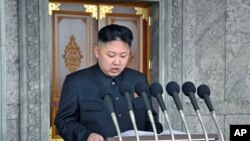 North Korean leader Kim Jong Un delivers a speech during a mass military parade in Kim Il Sung Square, April 15, 2012.
