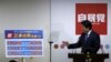 Japan's Prime Minister Shinzo Abe explains his three new arrows of 'Abenomics' policy, during a news conference after he was reelected as the party leader at the party headquarters in Tokyo, Sept. 24, 2015. 