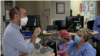 The Rev. Matthew Arlyck chats with staff at Enstein Medical Center Philadelphia in Pennsylvania. The chaplain offers spiritual support to staff as well as patients. (Photo courtesy of Einstein Medical Center Philadelphia) 