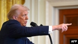 US President Donald Trump takes questions during a press conference with unseen Israel's Prime Minister Benjamin Netanyahu in the East Room of the White House in Washington, DC, on February 4, 2025. (Photo by ANDREW CABALLERO-REYNOLDS / AFP)