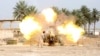 Iraqi security forces fire cannon during clashes with al Qaeda-linked Islamic State in Iraq and the Levant (ISIL), Jurf al-Sakhar, south of Baghdad, March 19, 2014.