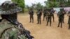ARCHIVO - Guerrilleros del Frente 33 de las disidencias de las FARC, con los que se enfrenta el ELN en el Catatumbo. Fotografía tomada el 12 de diciembre de 2024 en el Catatumbo, Colombia. [Foto: Johan Reyes, VOA].