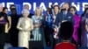 Britain's Prince Charles and Queen Elizabeth II are joined on stage with the rest of the Royal family as well as performers at the Queen's Jubilee Concert in front of Buckingham Palace, London, June 4, 2012. 