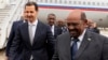 In this photo released by the Syrian official news agency SANA, Syrian President Bashar al-Assad, left, meets with Sudan's President Omar al-Bashir in Damascus, Syria, Dec. 16, 2018. 