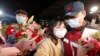 A medical team member hugs a family member at the end of a 14-day quarantine following the team's return from Wuhan, the epicentre of China's coronavirus disease (COVID-19) outbreak, at a hospital in Shanghai, China April 1, 2020.
