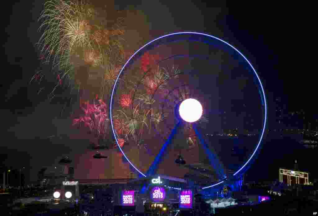 Fireworks explode over the Victoria Harbor as celebrating the 2015 new year in Hong Kong, Jan. 1, 2015.