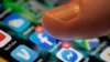 FILE - An iPhone displays the apps for Facebook and Messenger in New Orleans, Aug. 11, 2019. 