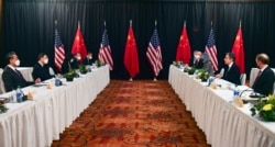 U.S. Secretary of State Antony Blinken, second right, and Chinese Foreign Minister Wang Yi, left, lead their delegations in U.S.-China talks in Anchorage, Alaska, March 18, 2021.