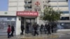 Riot police stand guard in front of the Centenario clinic where Peru's former President Alberto Fujimori is hospitalized, in Lima, Peru, Oct. 4, 2018. 