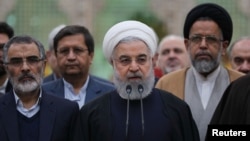 Presiden Iran Hassan Rouhani dalam kunjungan ke tempat pendiri Iran, Ayatollah Ruhollah Khomeini, di selatan Teheran, Iran, 30 Januari 2019. 