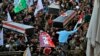 Mourners carry the coffins of Iran-backed Popular Mobilization Forces fighters killed in a U.S. airstrike in Qaim, during their funeral in Najaf, Iraq, Dec. 31, 2019. 