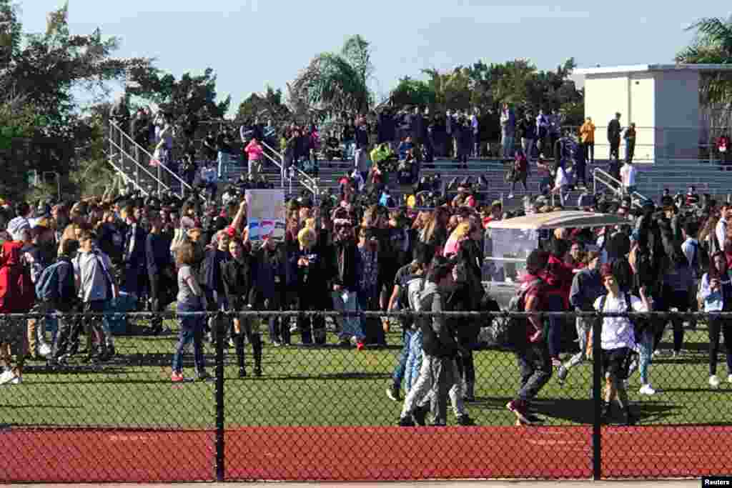 Students walkout at Marjory Stoneman Douglas High School during National School Walkout to protest gun violence in Parkland, Florida, March 14, 2018.