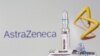 FILE - A test tube labeled "Vaccine" is seen in front of the AstraZeneca logo in this illustration photo taken Sept. 9, 2020. 