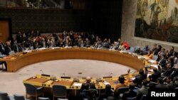 FILE - Members of the U.N. Security Council vote on a U.S. draft resolution calling for free and fair presidential elections in Venezuela at U.N. headquarters in New York, Feb. 28, 2019. 