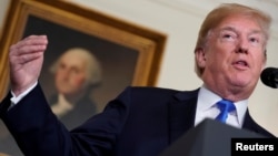 FILE - U.S. President Donald Trump delivers remarks before signing a memorandum on intellectual property tariffs on high-tech goods from China, at the White House in Washington, March 22, 2018.