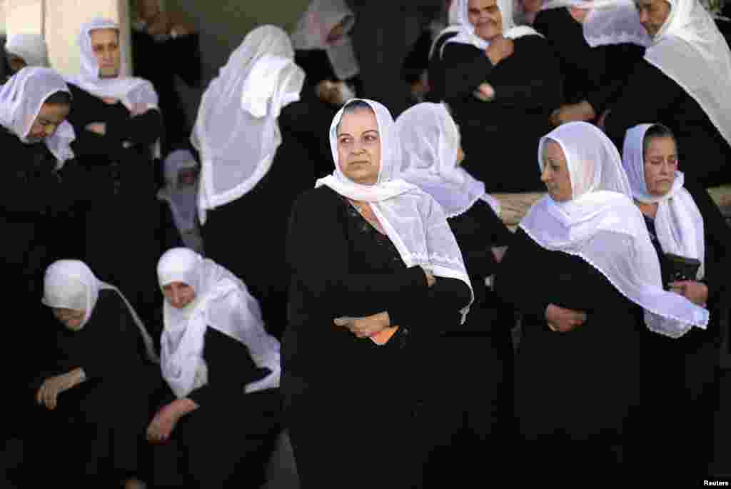Druse women mourn during the funeral of Israeli border police officer Jedan Assad in the village of Beit Jann in Israel's northern Galilee, Nov. 6, 2014.