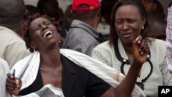 A woman at the Chiromo funeral home in Nairobi cries after she viewed the body of a relative killed in Thursday's attack on a Kenyan university, April 4, 2015.