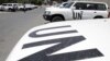 Vehicles belonging to United Nations observers are parked in front of a hotel in Damascus July 2, 2012. 