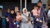 Members of the Muslim community leave after attending a national remembrance service in Christchurch on March 13, 2021, to mark two years since the March 15, 2019, Christchurch mosque attacks in which 51 people were killed and dozens were injured. 