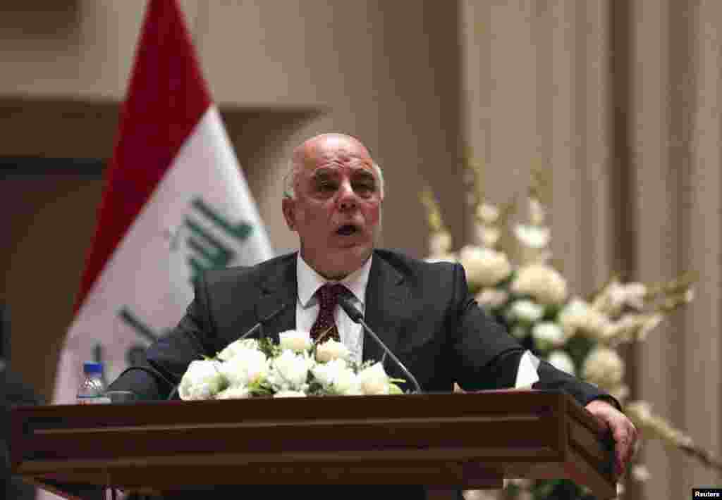 Iraq's incoming Prime Minister Haider al-Abadi speaks to Iraqi lawmakers before submitting his government selections, in Baghdad, Sept. 8, 2014.
