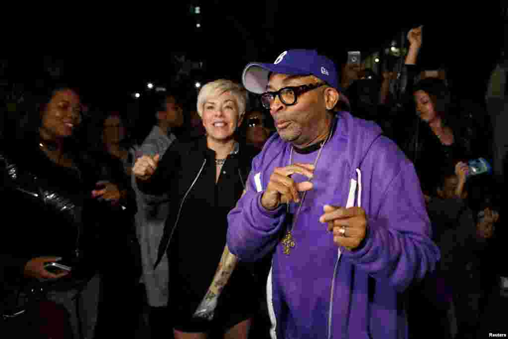 Director Spike Lee dances at a street party he hosted called "PRINCE We Love You Shockadelica Joint" to celebrate the life and music of deceased musician Prince in the Brooklyn borough of New York, April 21, 2016.
